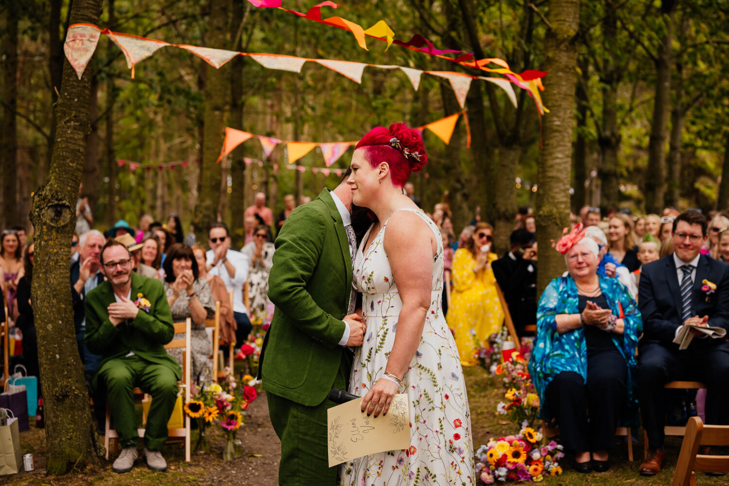 Couple embrace during woodland ceremony at Townend Farms