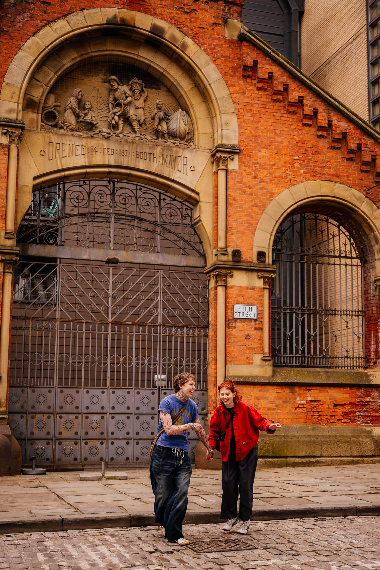 Couple dancing and laughing in front of of fish market wholesalers