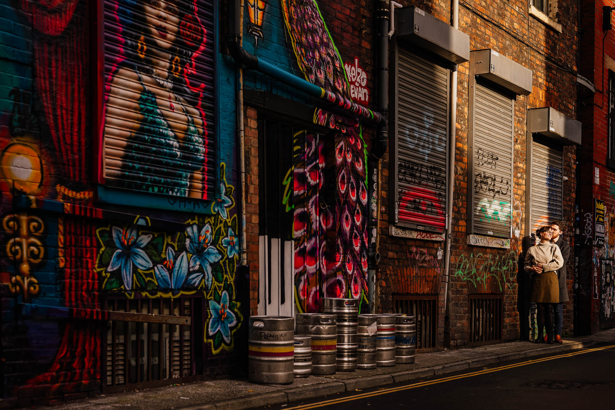 Couple portriaits in sunny patch of Little Lever Street