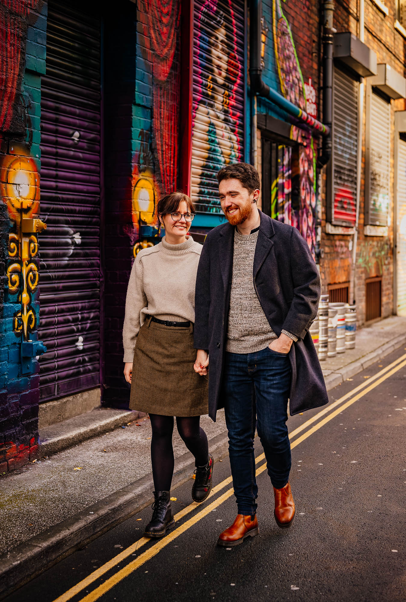 Couple walking down Little Lever Street in the Northern Quarter