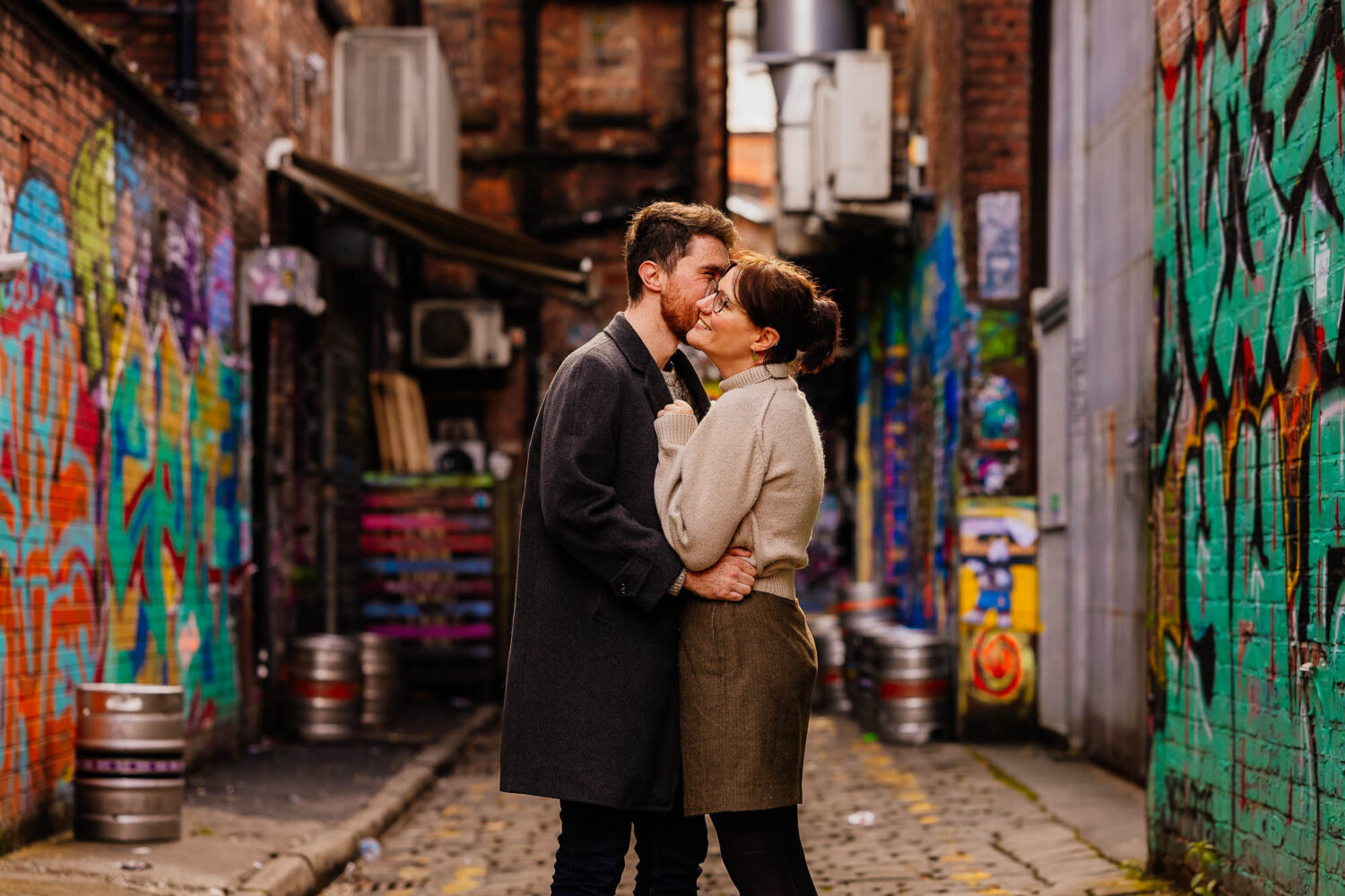 Couple portraits down colourful alleyway in Northern Quarter