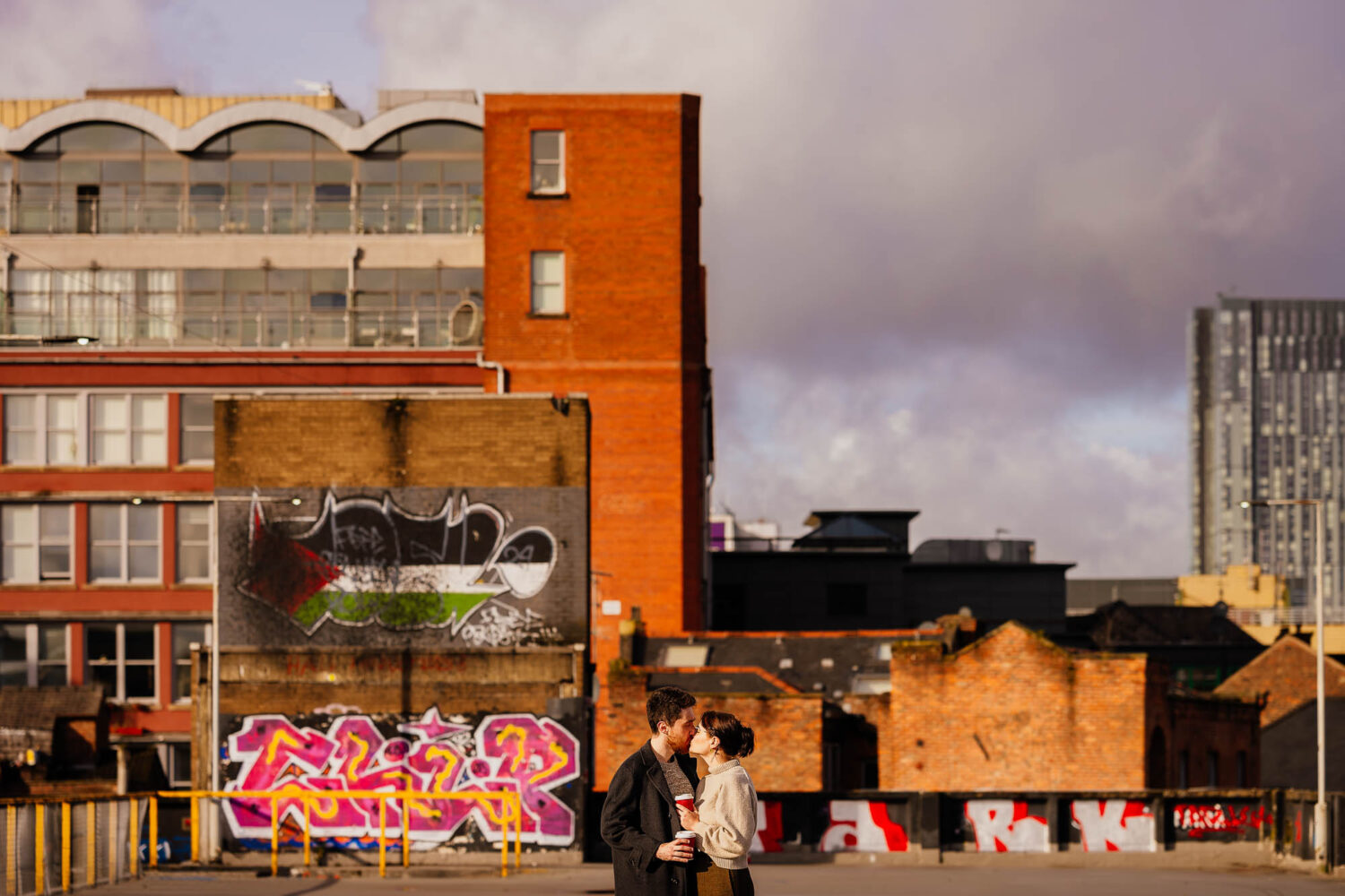 Couple kissing on the roof of Northern Quarter multi-storey car park