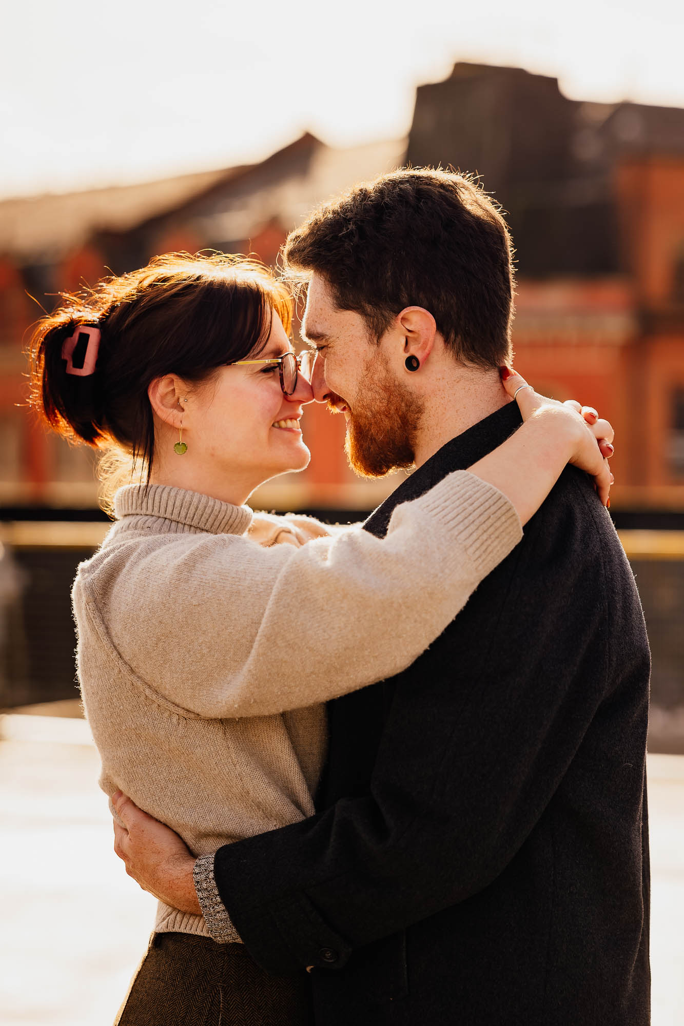 Couple hugging backlit by the sun