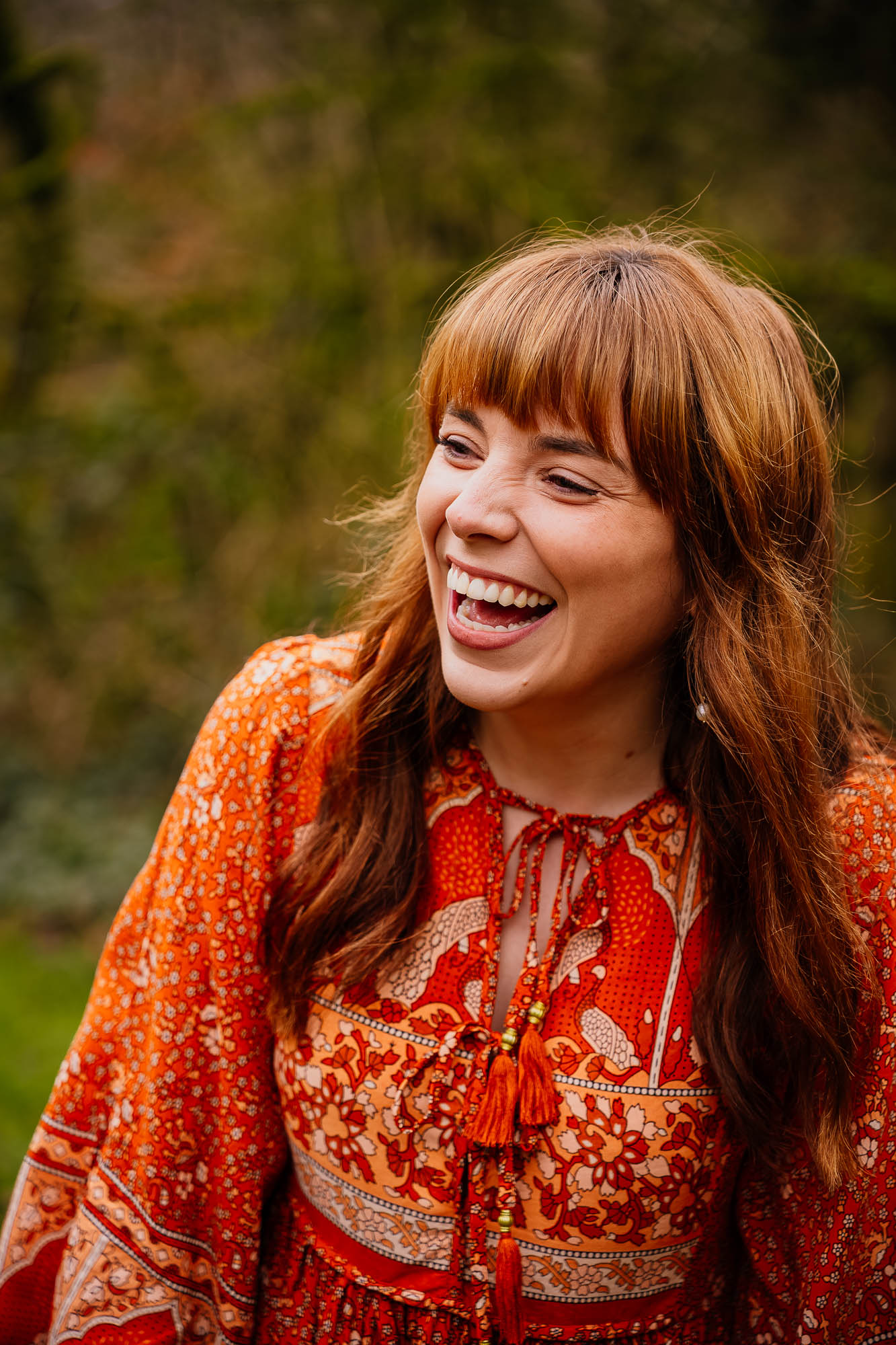 Portrait of woman laughing and smiling in woodland