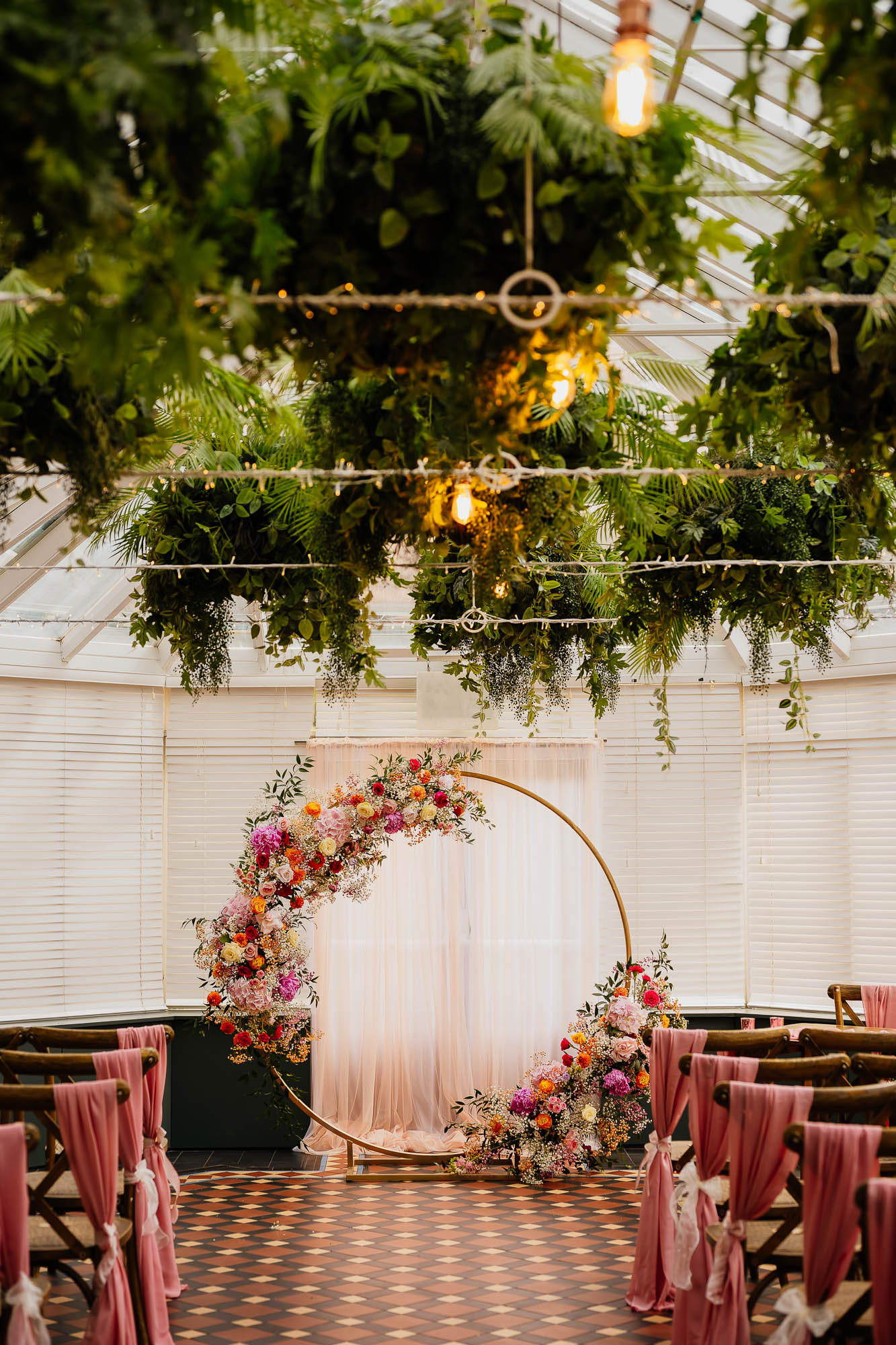 The Faversham conservatory with foliage dangling from ceiling and feature flower ceremony ring