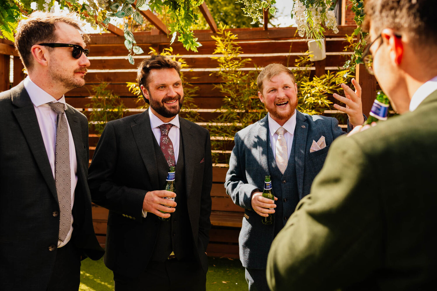 Wedding guests chatting on the terrace
