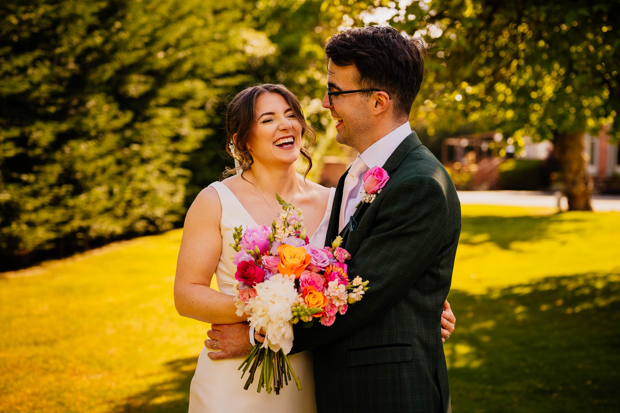 Bride and groom outside The Faversham on the lawn