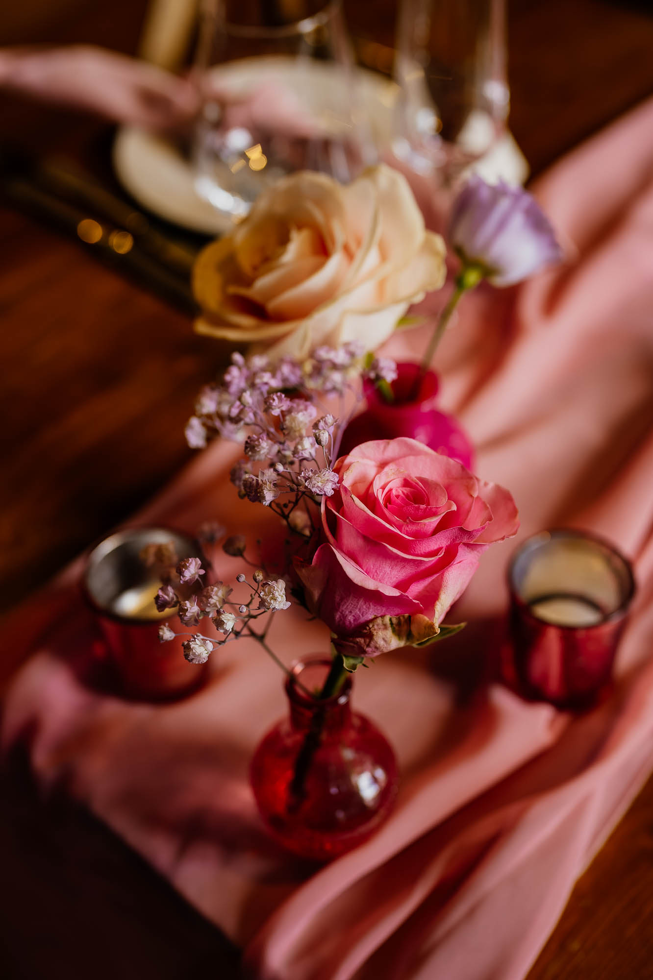 Pink flowers on pink table wedding decor