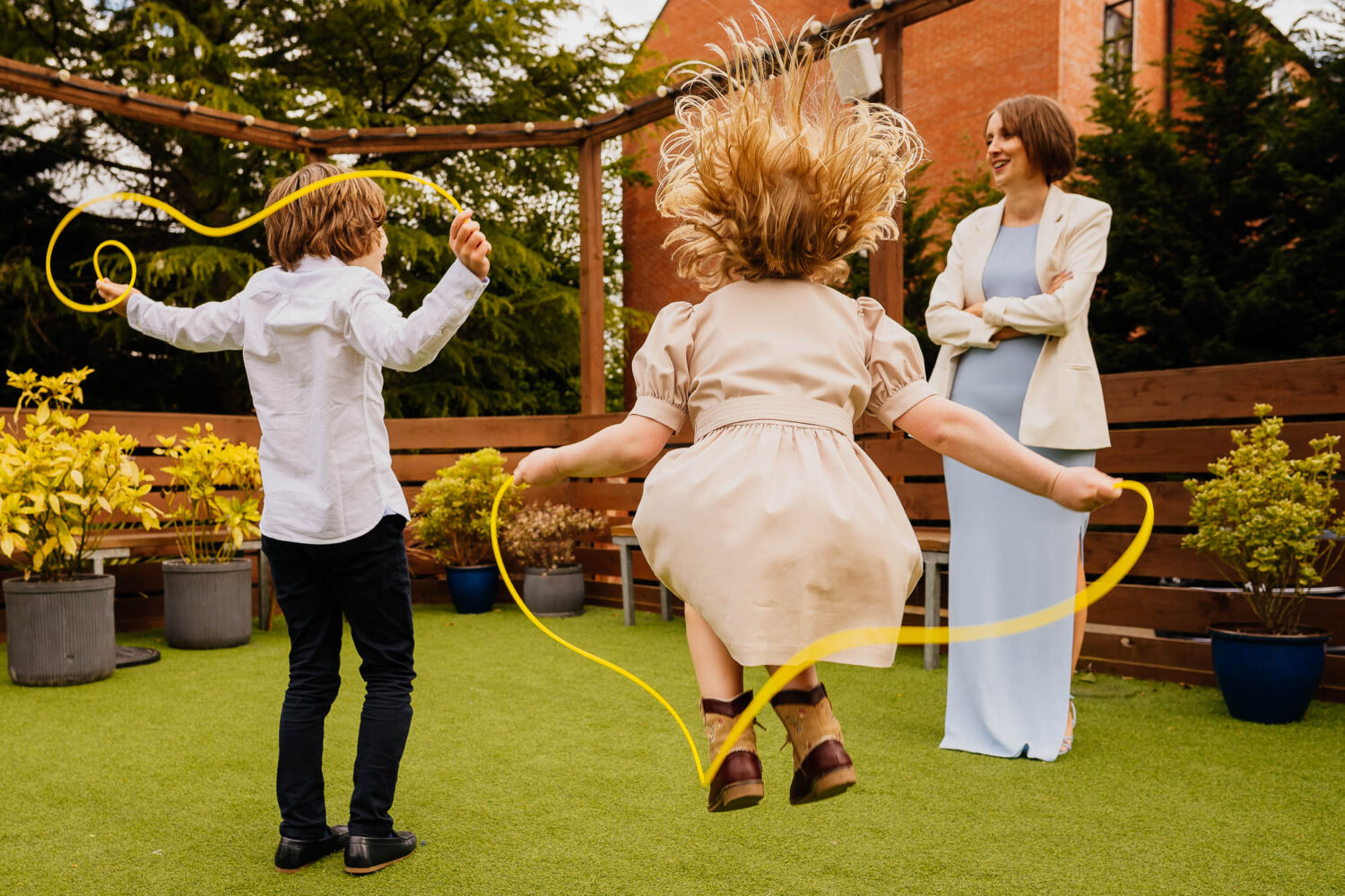 Kids playing skipping rope on the terrace