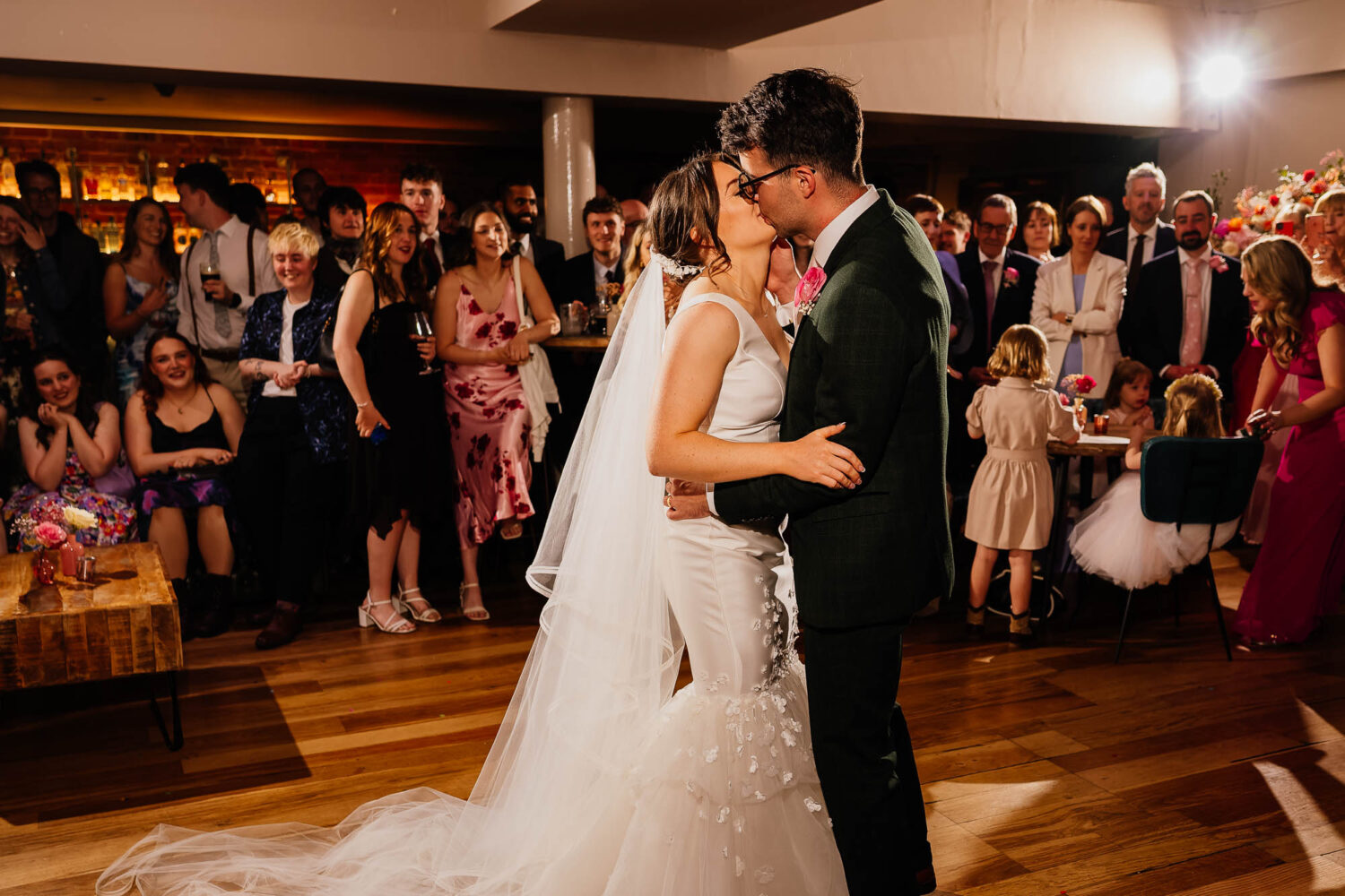 Couple kissing during first dance in the main room at The Faversham
