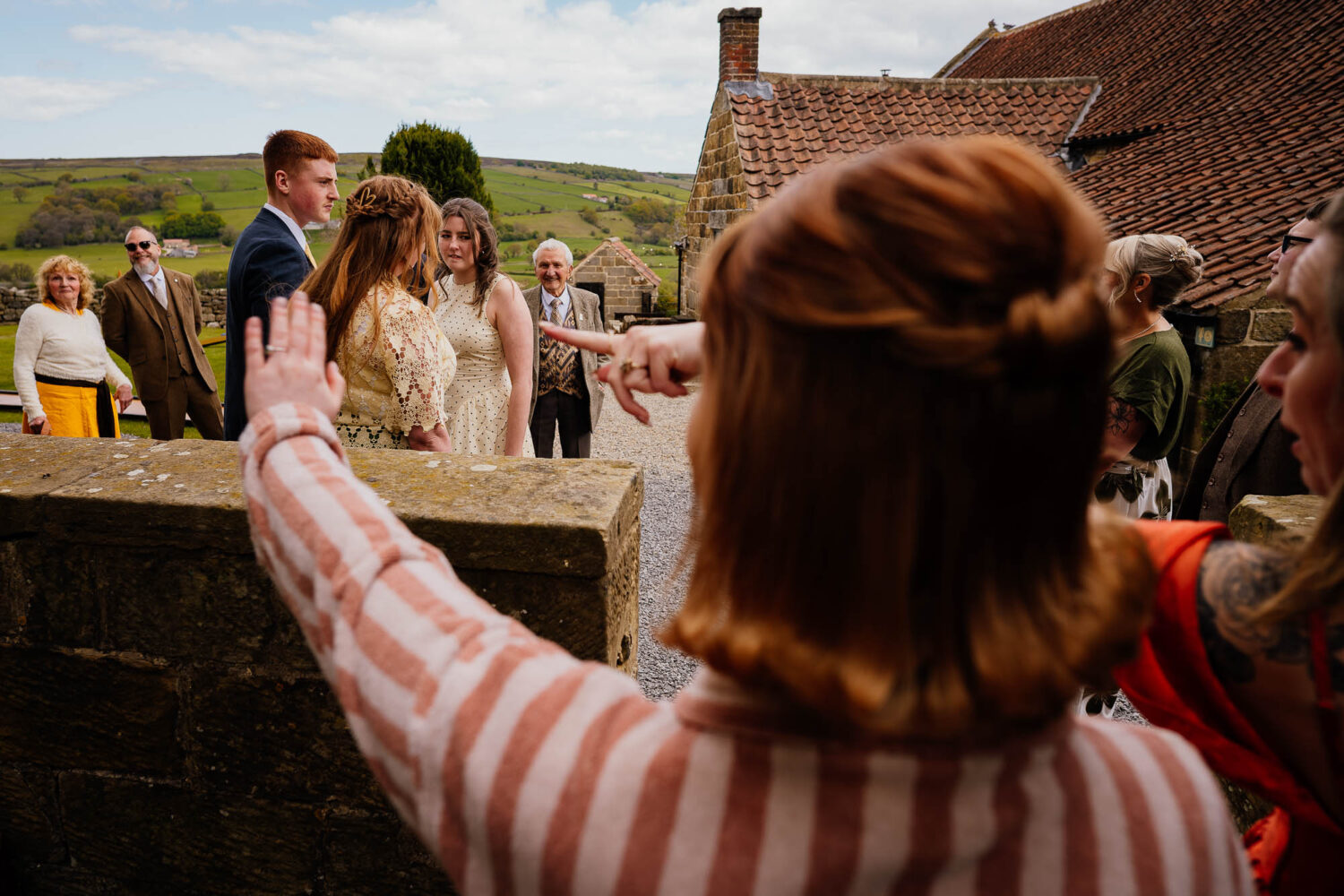 Guests seeing bride who is ushering them away