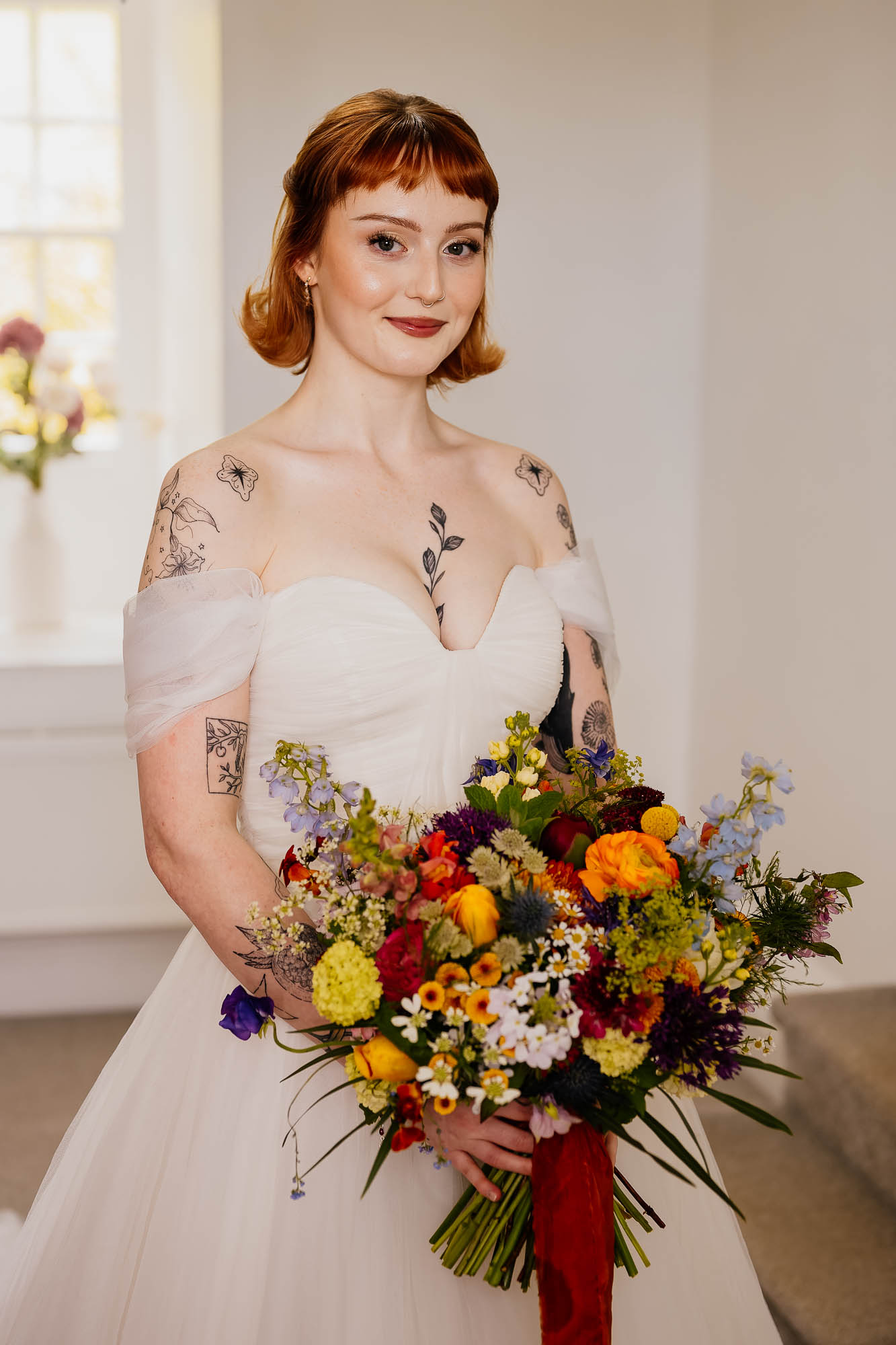 Bridal portrait with flowers in the getting ready room at Danby Castle