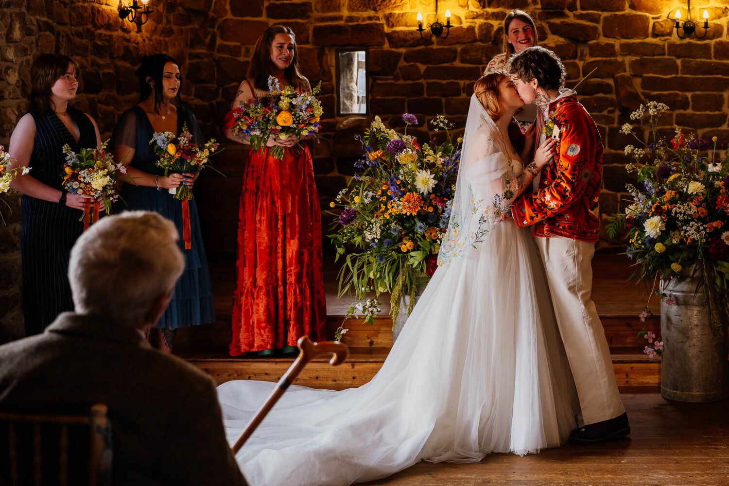 First kiss in ceremony at Danby Castle with grandad watching