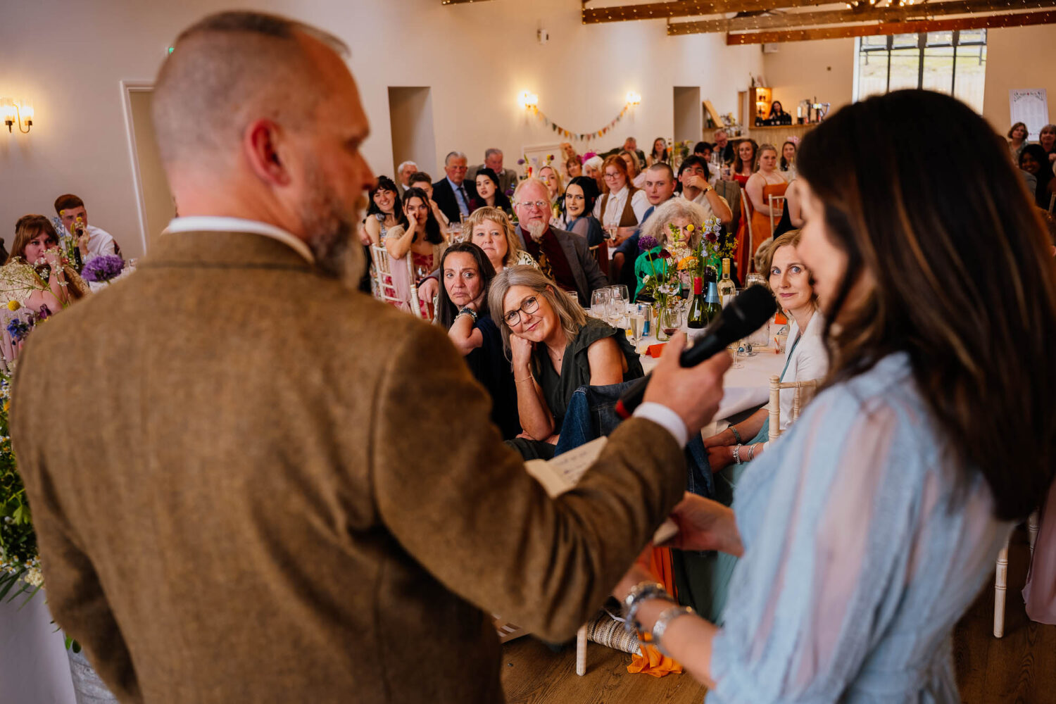 Guests watching and listening to parents speech