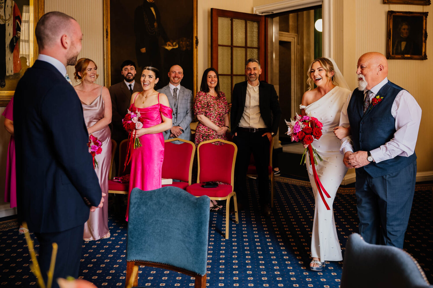 Ceremony entrance with bride and guests smiling