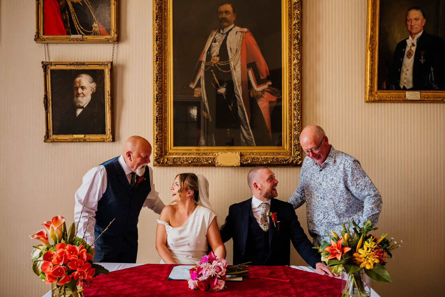 Couple looking at their dads during signing at Leeds Civic Hall