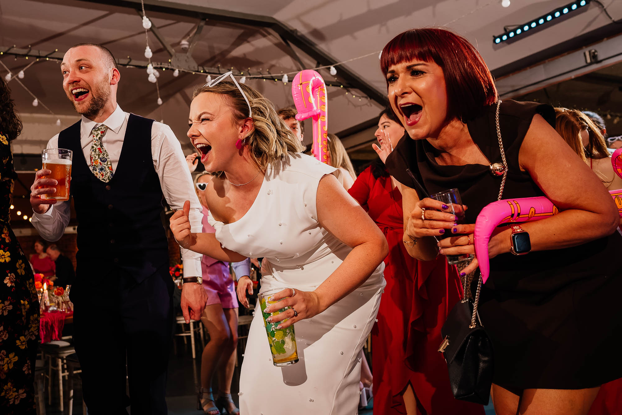 Bride groom and guest singing at New Craven Hall wedding