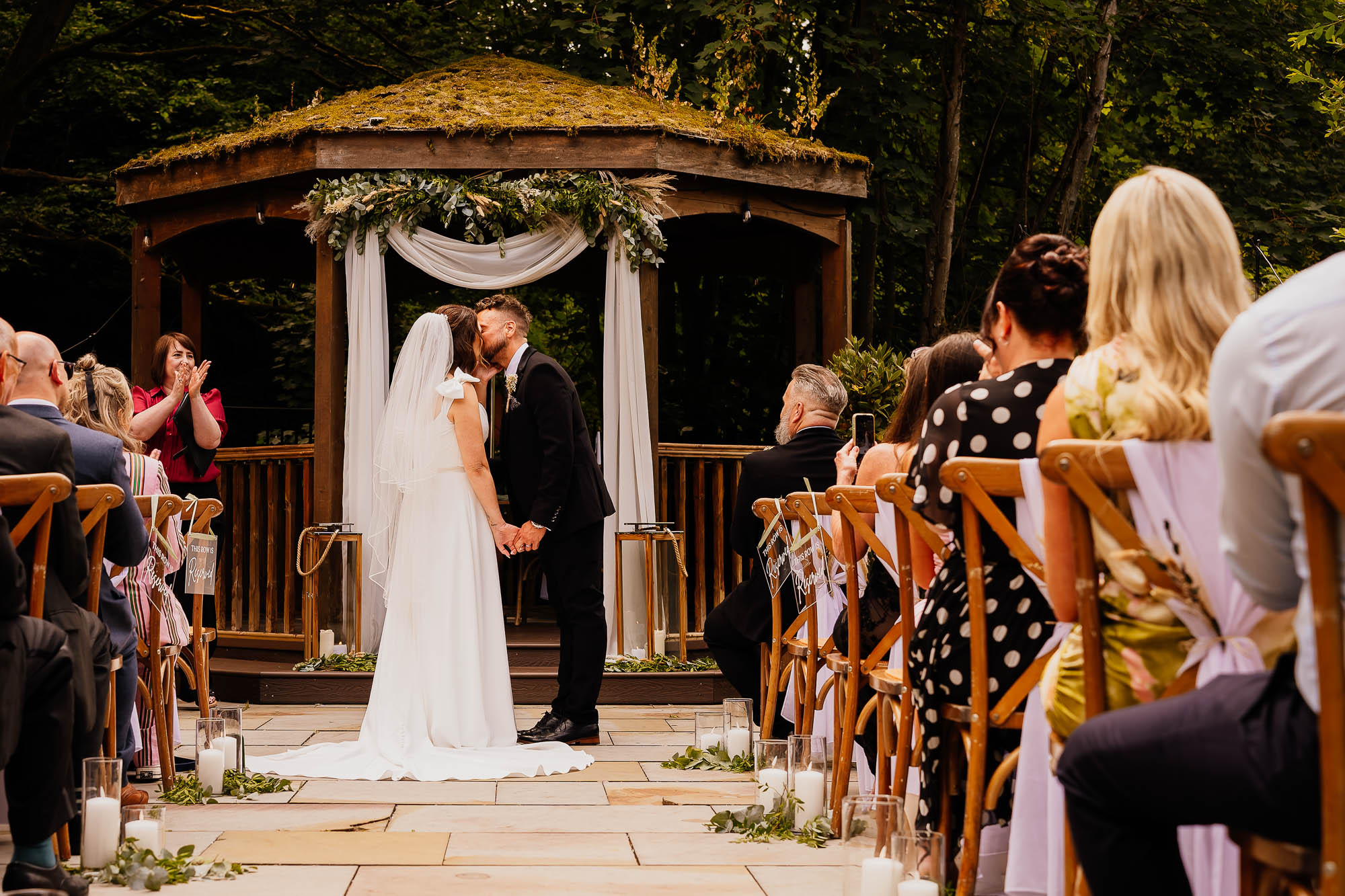 First kiss during outdoor ceremony at The Venue Bowers Mill